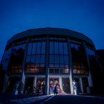 A bride and groom pose for a night photo outside the art gallery rotunda at the Columbus Centre courtyard.