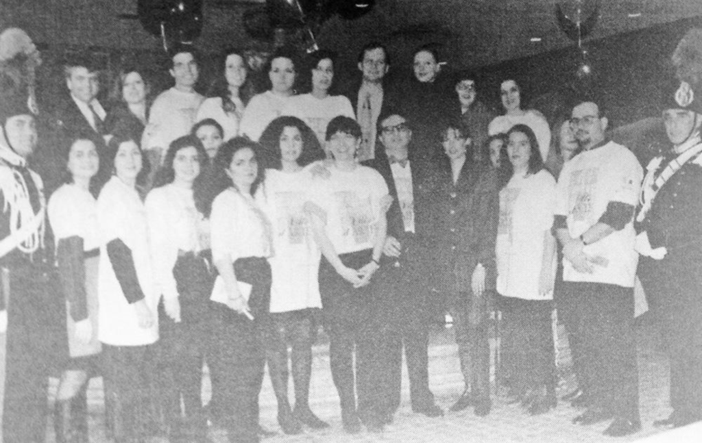 Co-chairs Roberto Martella (top L) and Catherine Barbaro (6th from R-in front row) posed with volunteers who helped at the event.