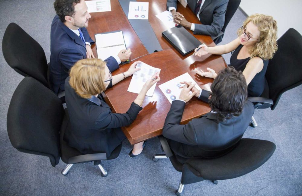 A group of people having a meeting.