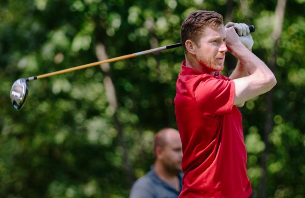 A male playing golf at the Villa Charities Annual Golf Classic.